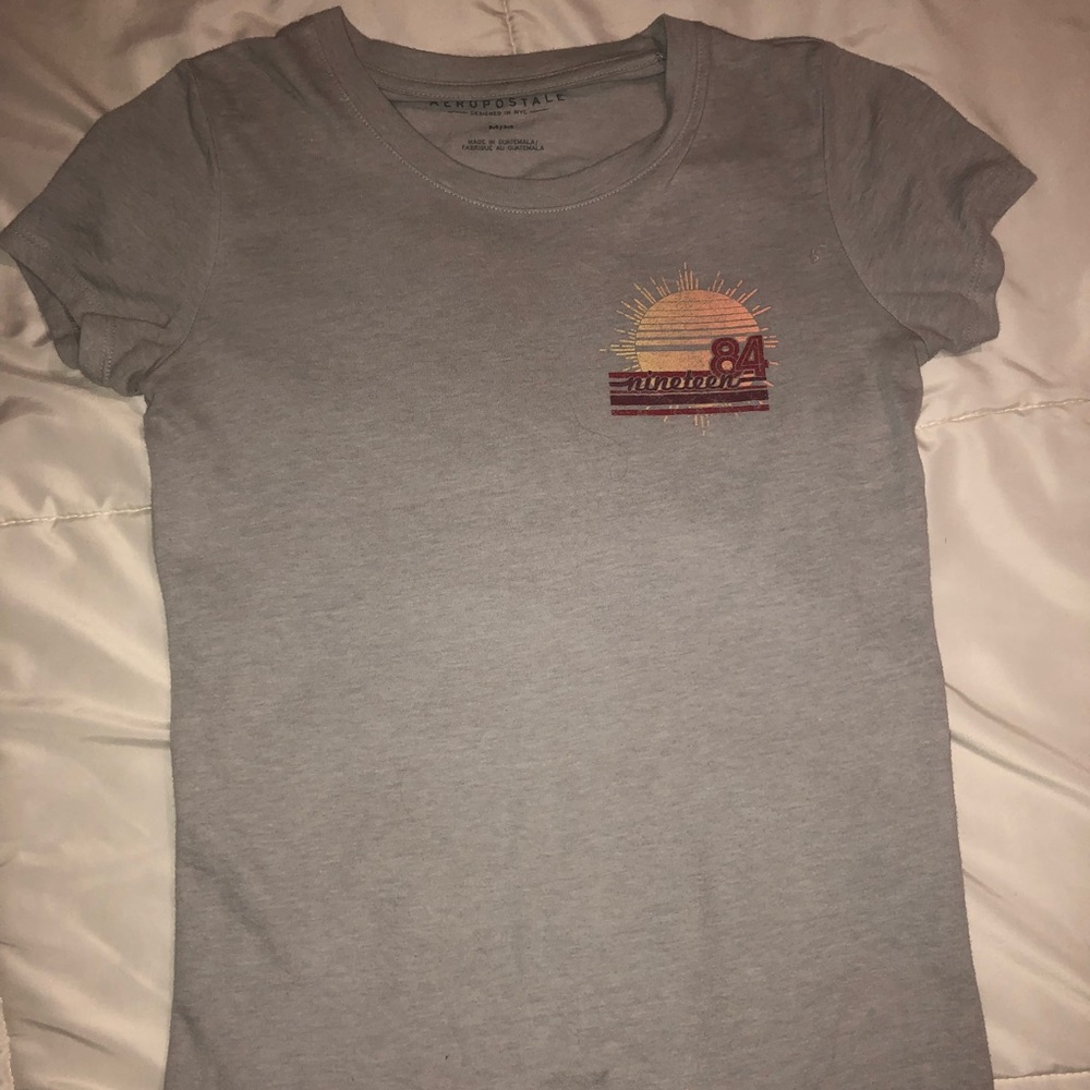 Light blue T-shirt.